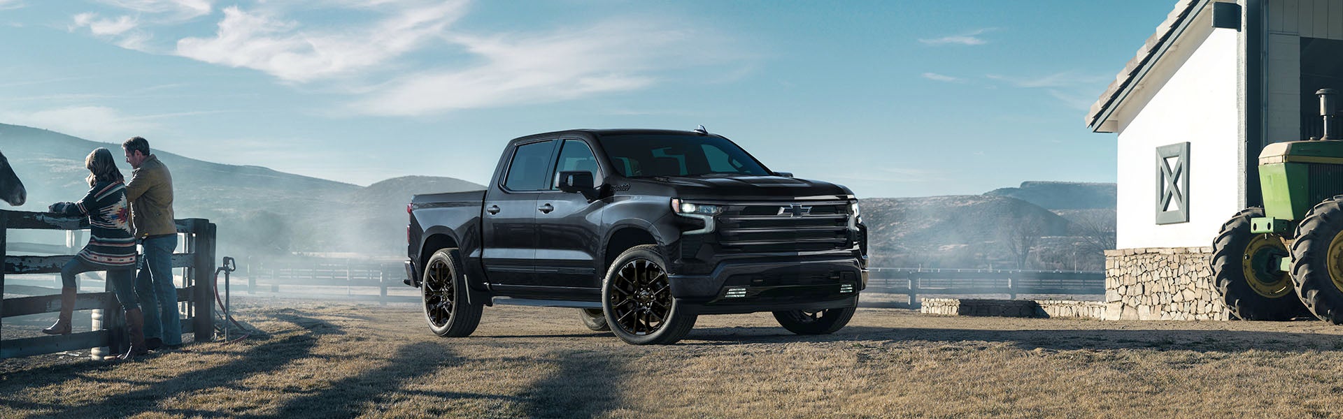black Silverado parked on grass in farmhouse