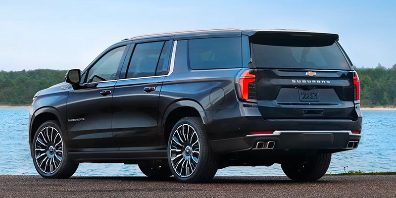 A black Suburban parked near river