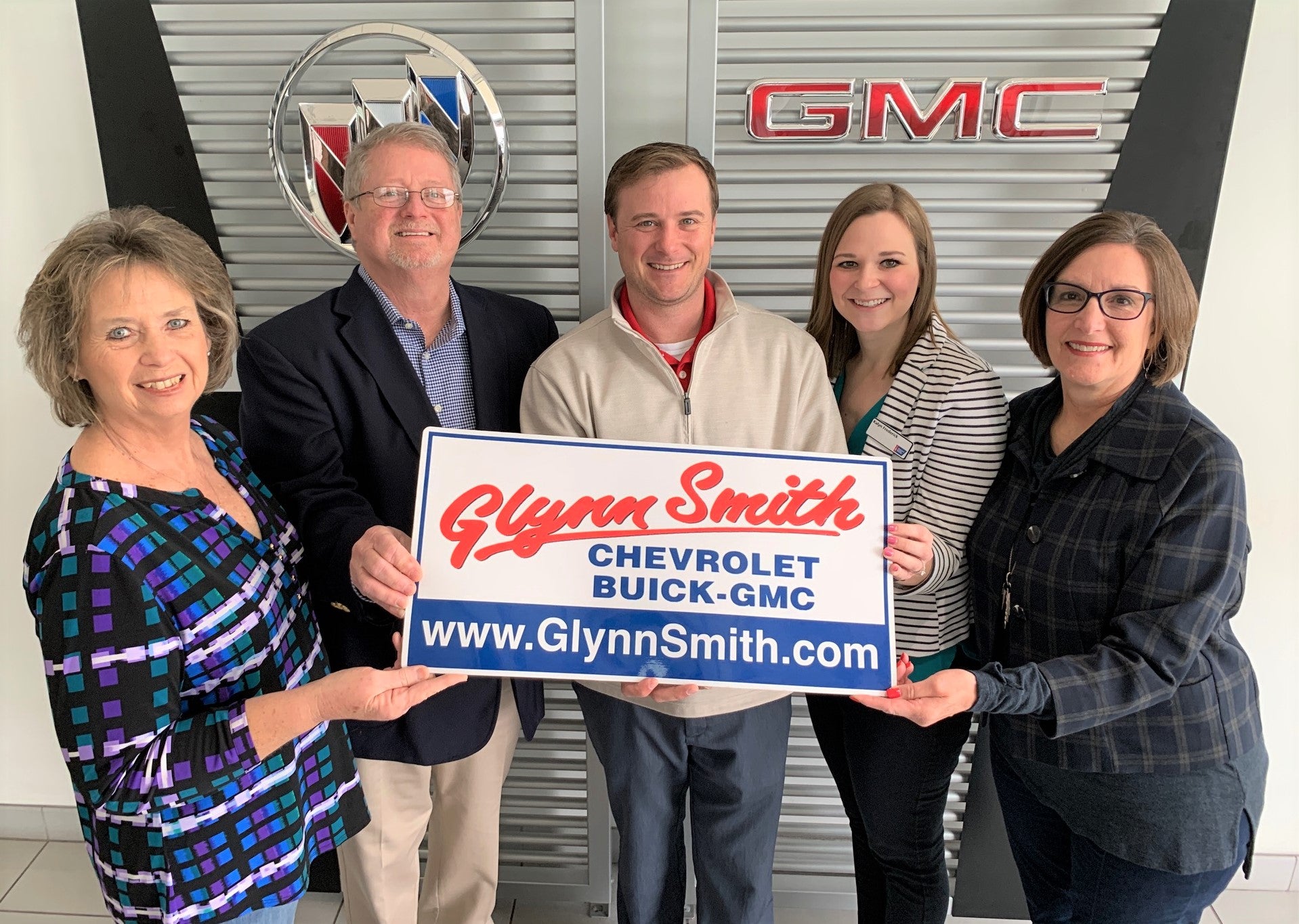 Holding Sign Inside the Dealership